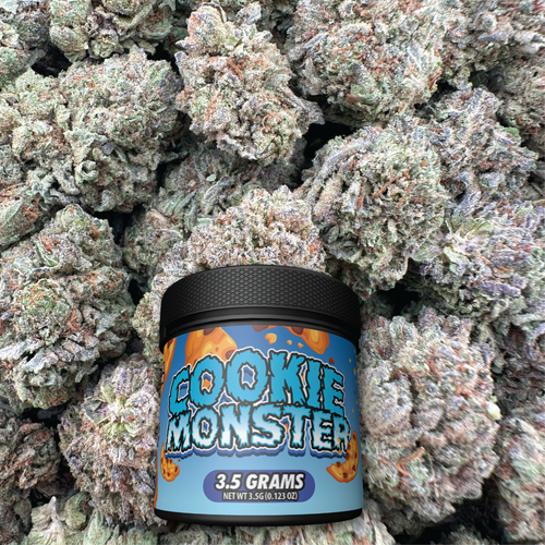 Jar labeled 'Cookie Monster' surrounded by buds